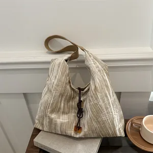 French vintage pleated canvas tote bag in creamy beige with brown straps and leaf patterns