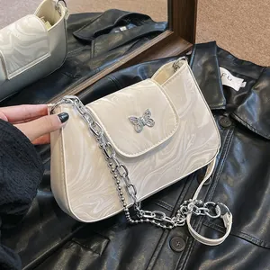 Chic marble-patterned underarm bag with silver butterfly buckle and chain strap