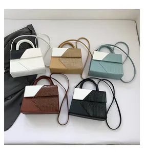 Five assorted crossbody handbags in varied colors featuring faux crocodile skin texture