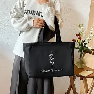 Grand sac cabas en toile noire avec motif rose et texte élégant pour femme style minimaliste