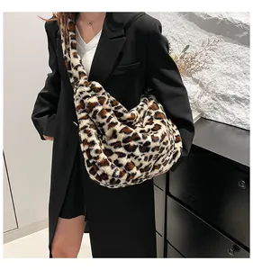 Detail view of leopard print plush tote bag showing soft faux fur texture and large capacity