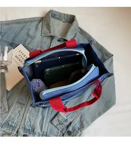 Top-down view of blue multi-compartment lunch tote showing high capacity interior space