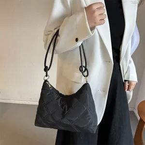 Quilted black hobo bag with padded knot shoulder strap and chic diamond stitch pattern