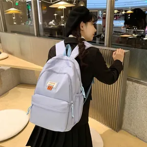 Zaino celeste minimalista di grande capacità per studentesse con etichetta alla moda