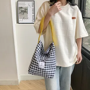 Checkered canvas tote bag with contrast yellow straps for casual commuting and school