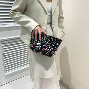 Fashionable sequin clutch bag with colorful iridescent pattern for casual occasions