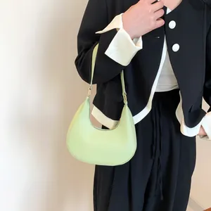 Minimalist pistachio green crescent moon shoulder bag in premium leather for women