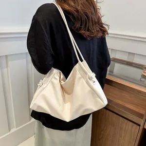 Cream-colored large PU leather tote bag with VCNCHU letter embossing and thin straps