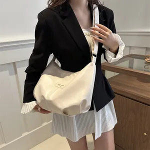 Fashionable creamy white large capacity crescent moon crossbody bag with adjustable wide strap
