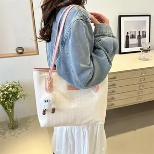 Large capacity white houndstooth tote bag with pink straps shown on a model for daily commute