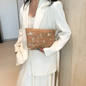 Summer woven straw envelope clutch bag with white floral embroidery for women