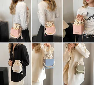 Detailed views of crossbody bucket bag with pearl handles and drawstring closure