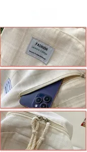 Detailansicht des Cord-Rucksacks mit strukturiertem Stoff, verstecktem Fach und Reißverschluss