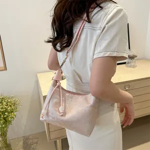 Elegant Chinese style jacquard crossbody bag in pink with floral patterns for daily use