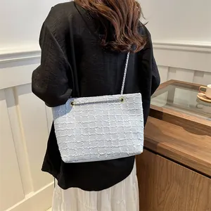 Large tweed chain shoulder bag for women in light blue, perfect for daily commute