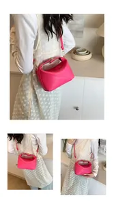 Detail of hot pink crossbody bag showing rich rabbit embossing and golden buckle hardware