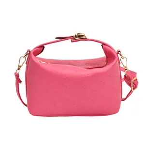 Pink crossbody handbag with Rich Rabbit embossed pattern and gold buckle hardware