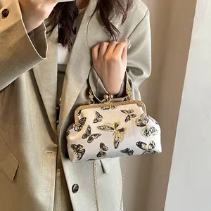 Elegant retro kiss-lock bag with butterfly embroidery and golden chain strap