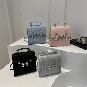 Versatile butterfly bow handbags in blue, pink, black, and silver for women