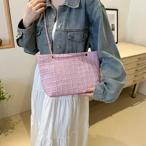 Pink tweed chain shoulder bag with woven texture for women, minimalist lifestyle view