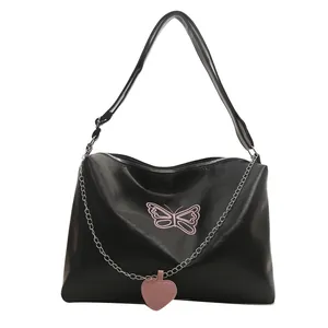 Black PU leather crossbody bag with pink butterfly embroidery and heart charm detail
