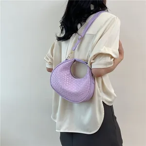 Lilac woven crescent handbag with gold hardware and shoulder strap for 2024 fashion