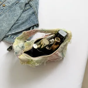 Detail view of large canvas tote bag interior showing capacity for makeup and phone