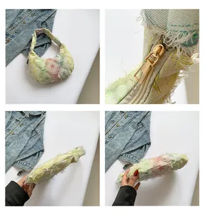 Detail of star pattern fabric bag with golden zipper and vintage frayed edges