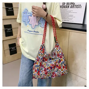 Floral canvas tote bag featuring cotton rope handles and a Sunshine woven label