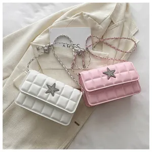 Detail of pink and white quilted handbags with star buckles and metal chain straps