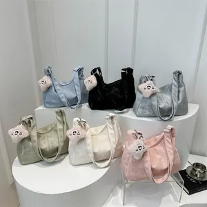 Minimalist large-capacity tote bags with star charms in various colors on display