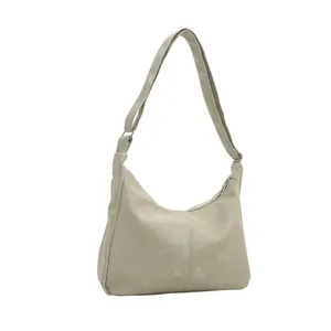 Minimalist beige PU leather hobo shoulder bag with adjustable strap and zip closure
