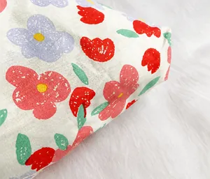 Detailed macro view of lightweight floral canvas fabric with strawberry pattern