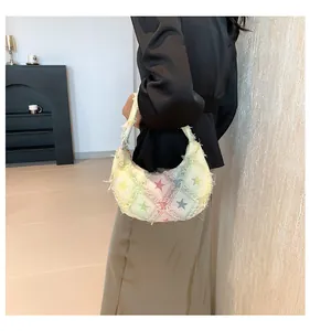 Detail of colorful star pattern canvas shoulder bag with unique frayed edge texture