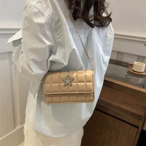 Beige quilted crossbody bag with silver star ornament and leather chain strap for women