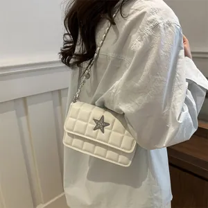 White quilted crossbody bag with star metal ornament and silver chain strap