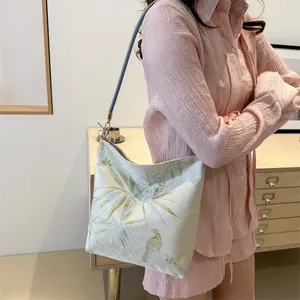 New Chinese style shoulder bag featuring gold silk embroidery and bamboo leaf patterns