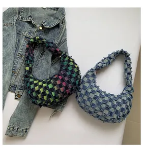 Close-up of retro checkered canvas hobo bags with distressed frayed edges details