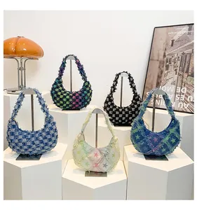 Collection of checkered and star pattern canvas hobo bags with frayed edge details