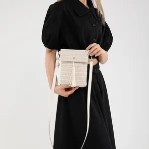 Chic beige straw crossbody bag with fringe tassel and metallic buckle for summer fashion