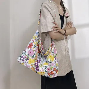 Floral canvas tote bag for women showing a large capacity shoulder crossbody design