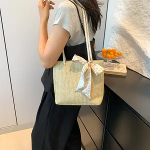 Straw tote bag with heart print scarf accent and woven rope straps for summer