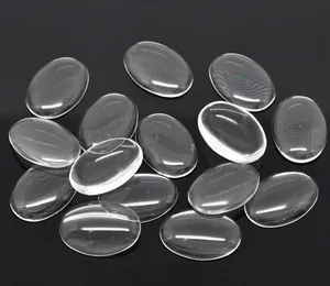 Macro view of transparent oval glass cabochons with smooth surface for DIY jewelry making