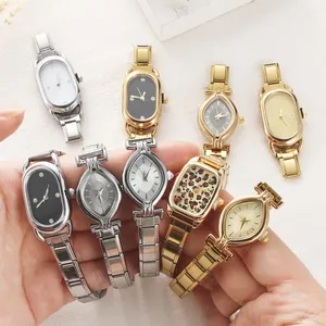 Macro view of vintage metal link chain watches with varied dial shapes and leopard patterns