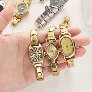 Detail of vintage stainless steel modular bracelets with leopard and oval patterned dials