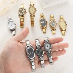 Detail of vintage modular link watches with leopard print and minimalist dial designs