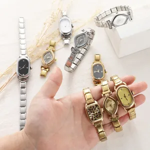 Detailed macro view of vintage quartz watches with diverse stainless steel link bands