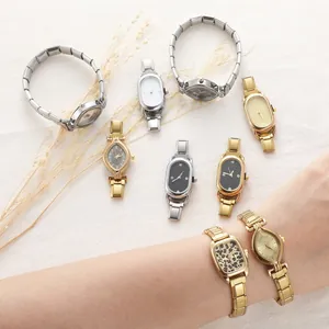 Detail view of vintage quartz watches with gold and silver alloy link bracelets for women