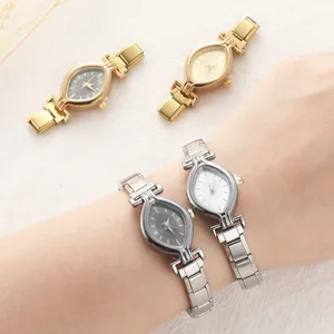 Chic almond-shaped women's metal watches in gold and silver finishes on textured fabric