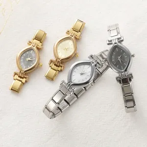 Macro shot of stylish vintage watches with cat-eye dials and stainless steel link bands